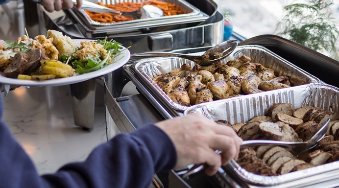 Lish corporate catering buffet showcasing delicious food being served.